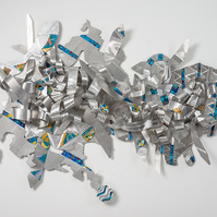 Dancing with Heavenly Blessings-Abstract Art Piece Hung on A Wall With Various Shapes that Resembles Ties. The Ties are Bent in Various Ways. The Piece is Silver with Orange and Blue Detail.