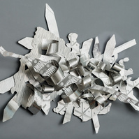 When Joy Chases Faith-Abstract Art Piece  With Various Shapes that Resembles Ties. The Ties are Bent in Various Ways. The Piece is Silver. 