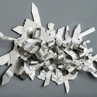 When Joy Chases Faith-Abstract Art Piece  With Various Shapes that Resembles Ties. The Ties are Bent in Various Ways. The Piece is Silver. 