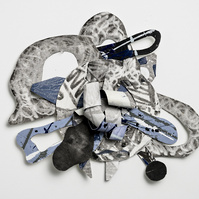 In Times Like These For Brianna  22x24x3-Abstract cutout art piece with various patterns and shapes. This piece consists of silver, blue, gray and black.