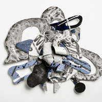In Times Like These For Brianna  22x24x3-Abstract cutout art piece with various patterns and shapes. This piece consists of silver, blue, gray and black.