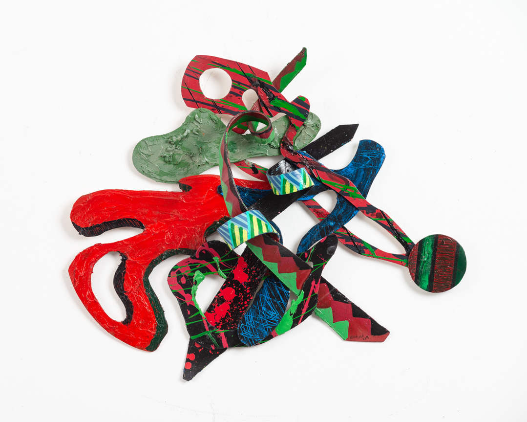 Landwhere-Multicolored Abstract Art Piece Hung on A Wall With Various Shapes that Resembles Ties. The Ties are Bent in Various Ways. 