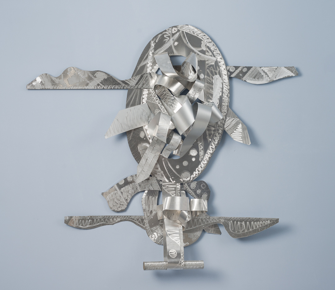 Balancing My Blessings--Abstract Art Piece With Various Shapes that Resembles Ties. The Ties are Bent in Various Ways. The Piece is Silver.