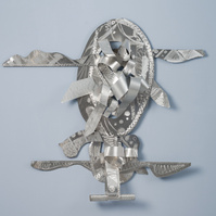 Balancing My Blessings--Abstract Art Piece With Various Shapes that Resembles Ties. The Ties are Bent in Various Ways. The Piece is Silver.