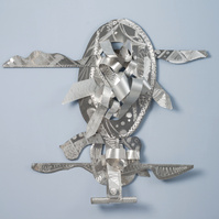 Balancing My Blessings--Abstract Art Piece With Various Shapes that Resembles Ties. The Ties are Bent in Various Ways. The Piece is Silver.