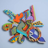 BackStreet Dreams-Multicolored Abstract Art Piece Hung on A Wall With Various Shapes that Resembles Ties. The Ties are Bent in Various Ways. 
