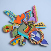 BackStreet Dreams-Multicolored Abstract Art Piece Hung on A Wall With Various Shapes that Resembles Ties. The Ties are Bent in Various Ways. 