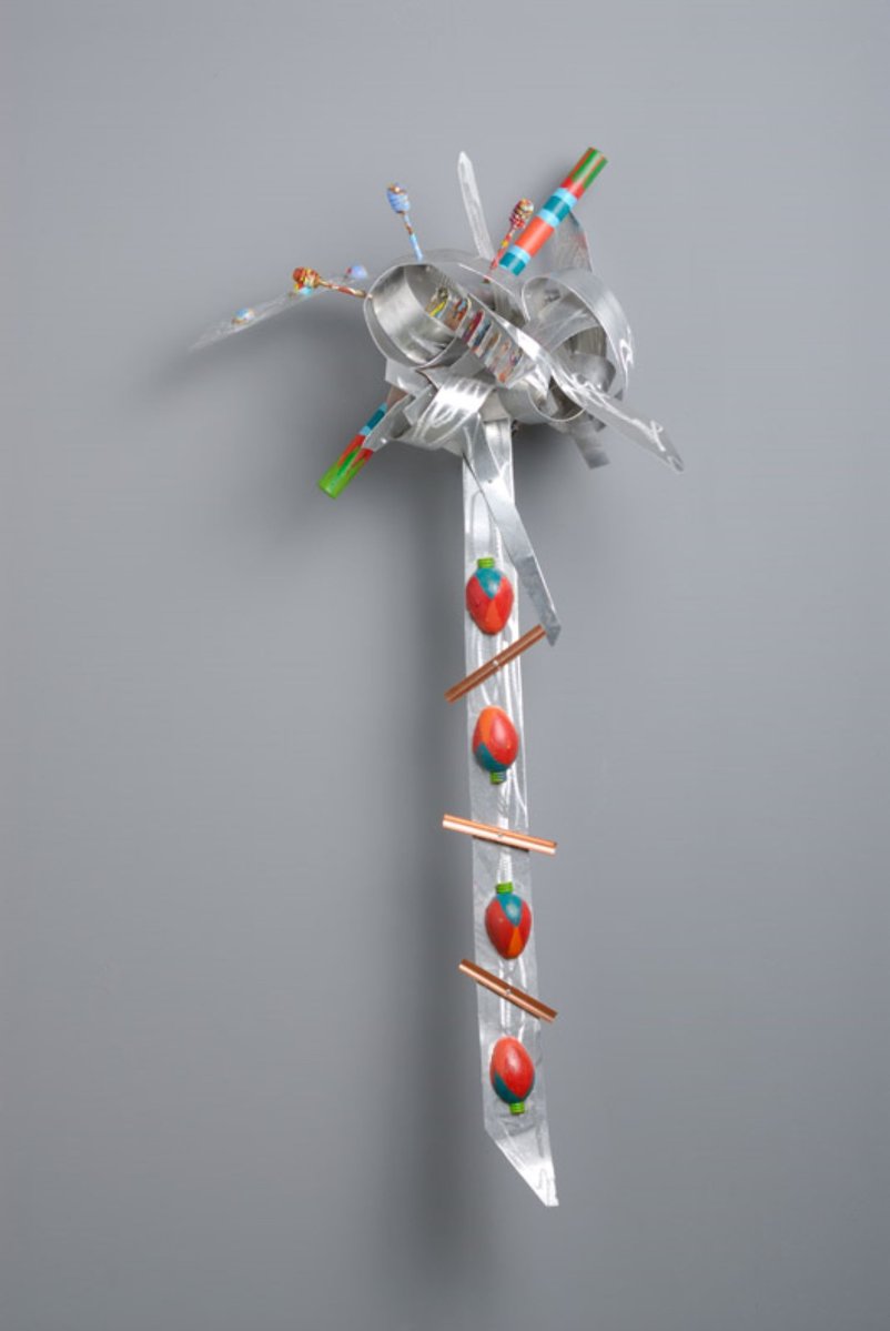 Another Strange Fruit-Abstract Art Piece With Various Shapes that Resembles Ties. The Ties are Bent in Various Ways. The Piece is Silver With Detail of Red Strawberries.