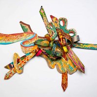 3 A. M. Wings For TC-Multicolored Abstract Art Piece Hung on A Wall With Various Shapes that Resembles Ties. The Ties are Bent in Various Ways. 