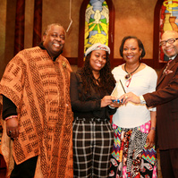 2020 TrailBlazer Award - Salem Bible Church- Four People In a Church Posing for a Photo. Two People are Holding the Same Award Trophy.