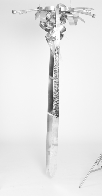 Do Lord Remember Me V- Abstract Ladder With Abstract Ties On The Top. The Ladder and Ties Are Silver.
