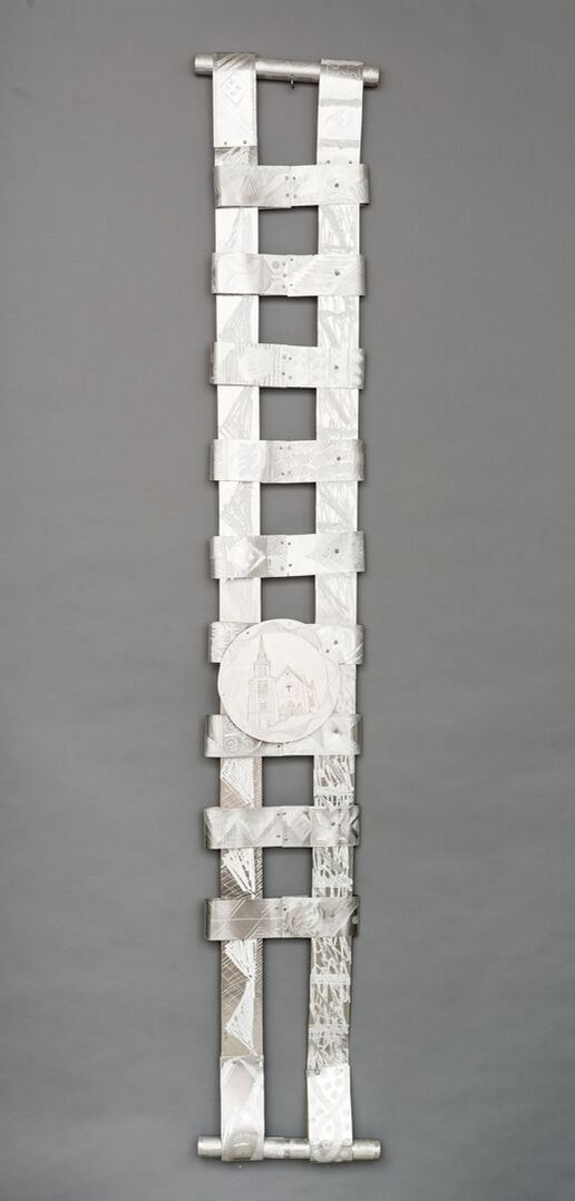 Swing Low  Sweet Chariot For The Emmanuel 9 -Abstract Art Piece With Various Shapes that Resembles Ties. The Ties are Bent in Various Ways. The Piece is Silver With Small Color Detail.