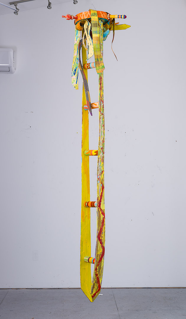 Ladder For Ms. Catlett-Abstract Yellow Ladder With Abstract Ties On The Top. The Ties Are Multicolored.
