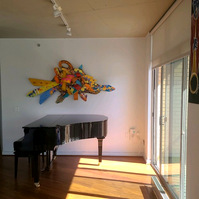 Living Through Adversity 43x86x8 Mixed Media on wood Private Commission Dareen Chaplin, Washington DC-Abstract Art Piece Mixed Media on Wood With Various Shapes And Warm Colors.This Piece is on a Wall Next to A Piano.