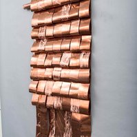 Bling Bling For All-Copper Art Piece That Resembles A Blanket 