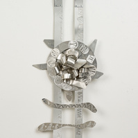 Target Ladder-Abstract Art Piece With Various Shapes that Resembles Ties. The Ties are Bent in Various Ways. The Piece is Silver.