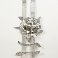 Target Ladder-Abstract Art Piece With Various Shapes that Resembles Ties. The Ties are Bent in Various Ways. The Piece is Silver.