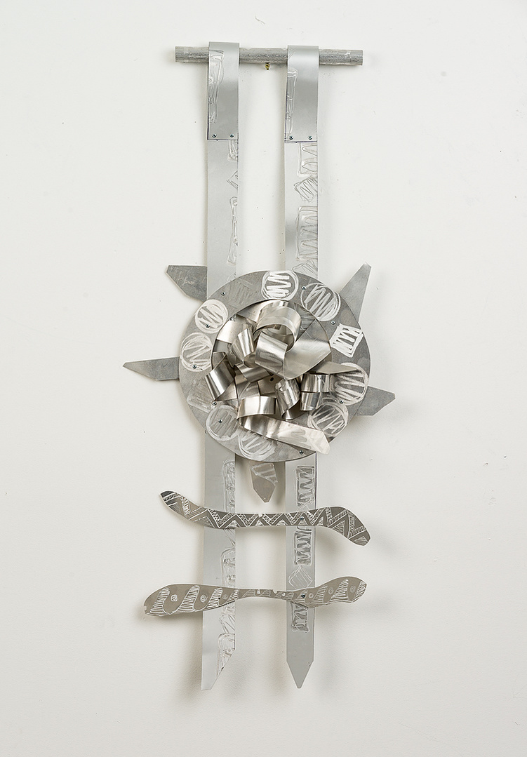 Target Ladder-Abstract Art Piece With Various Shapes that Resembles Ties. The Ties are Bent in Various Ways. The Piece is Silver.
