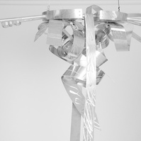 Do Lord Remember Me V Detail -Abstract Ladder With Abstract Ties On The Top. The Ladder and Ties Are Silver.