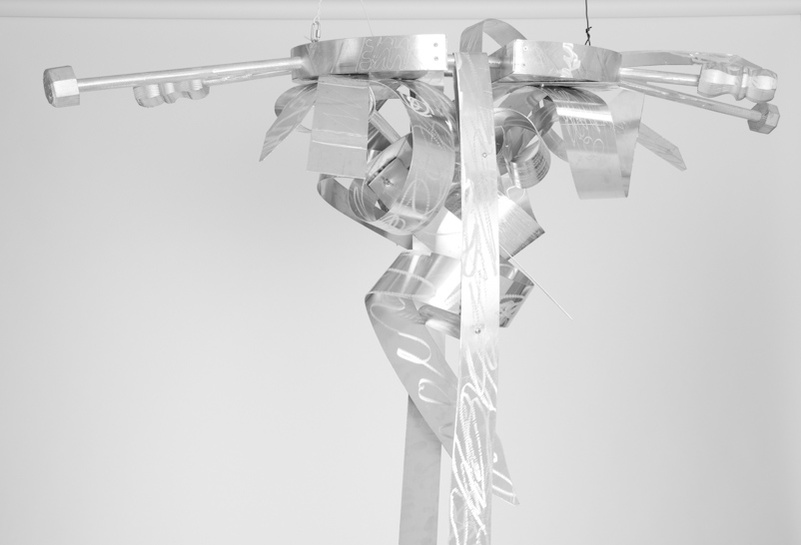 Do Lord Remember Me V Detail -Abstract Ladder With Abstract Ties On The Top. The Ladder and Ties Are Silver.