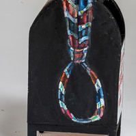 Conversation With The  Proud Boys Detail  - Black Mailbox with a Red and Blue Tie in The Shape of a Noose