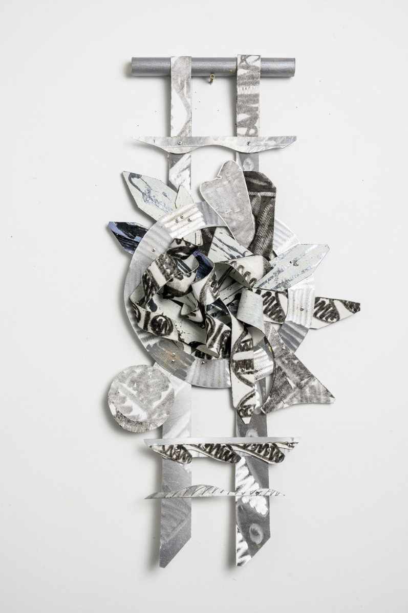 In Times Like These Ladder For Ahmaud-Abstract cutout art piece on paper that resembles a ladder with abstract shapes in the middle of the ladder.  The colors of this piece are silver with hints of black.