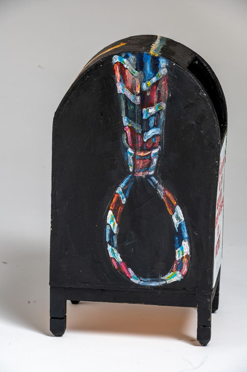 Conversation With The  Proud Boys Detail  - Black Mailbox with a Red and Blue Tie in The Shape of a Noose