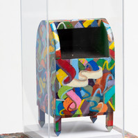 Coat of Many Colors - Mailbox with Abstract Shapes and Various Colors Inside of A Clear Box