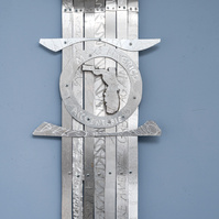  Swing State Florida-Abstract Tie Art Piece With Several Straight Ties and The State Of Florida Shape in the Middle. The Art Piece is Aluminum.