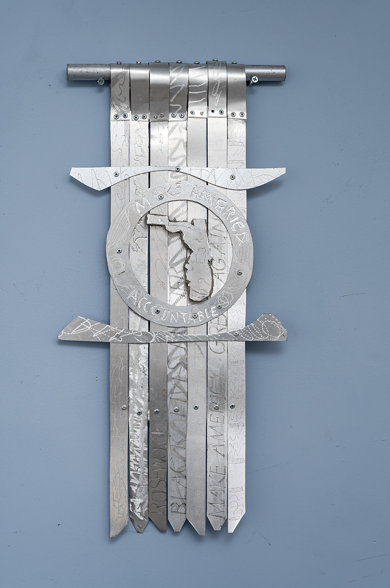  Swing State Florida-Abstract Tie Art Piece With Several Straight Ties and The State Of Florida Shape in the Middle. The Art Piece is Aluminum.