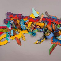 Unsung For Bob-Multicolored Abstract Art Piece Hung on A Wall With Various Shapes that Resembles Ties. The Ties are Bent in Various Ways. 