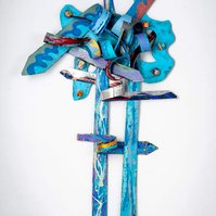 In Search Of The Truth-Multicolored Abstract Art Piece Hung on A Wall With Various Shapes that Resembles Ties. The Ties are Bent in Various Ways. 