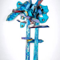 In Search Of The Truth-Multicolored Abstract Art Piece Hung on A Wall With Various Shapes that Resembles Ties. The Ties are Bent in Various Ways. 