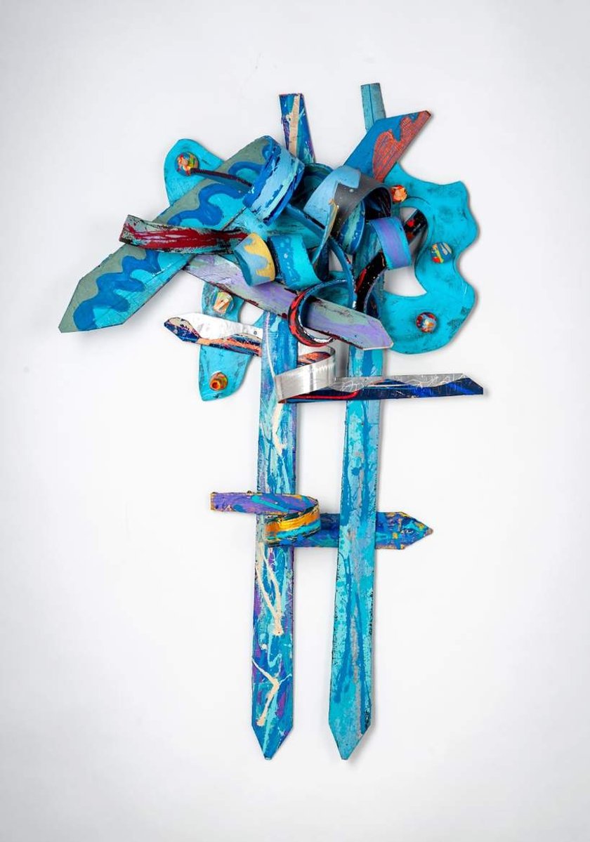 In Search Of The Truth-Multicolored Abstract Art Piece Hung on A Wall With Various Shapes that Resembles Ties. The Ties are Bent in Various Ways. 