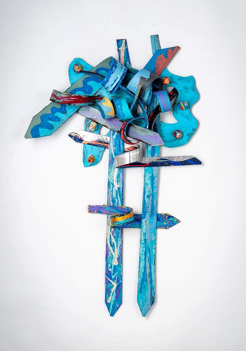In Search Of The Truth-Multicolored Abstract Art Piece Hung on A Wall With Various Shapes that Resembles Ties. The Ties are Bent in Various Ways. 