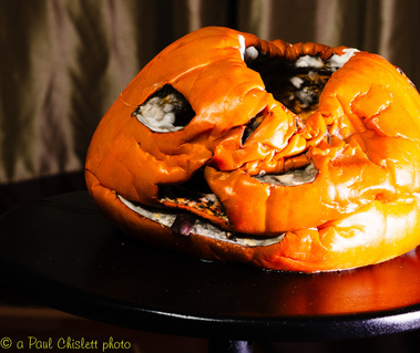 A three week old pumpkin that has collapsed on itself.