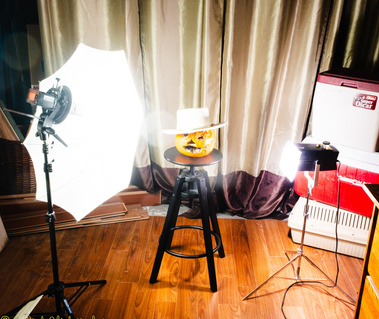 A behind-the-scene photo showing my lighting set up.

There are 2 light stands, and a Godox AD200 pro and a much older Honeywell 202 flash.