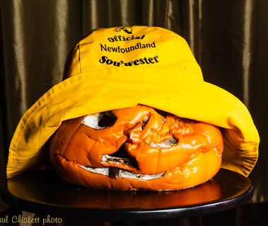 A collapsed pumpkin wearing a sou-wester, traditional Newfoundland fisherman's rain hat.