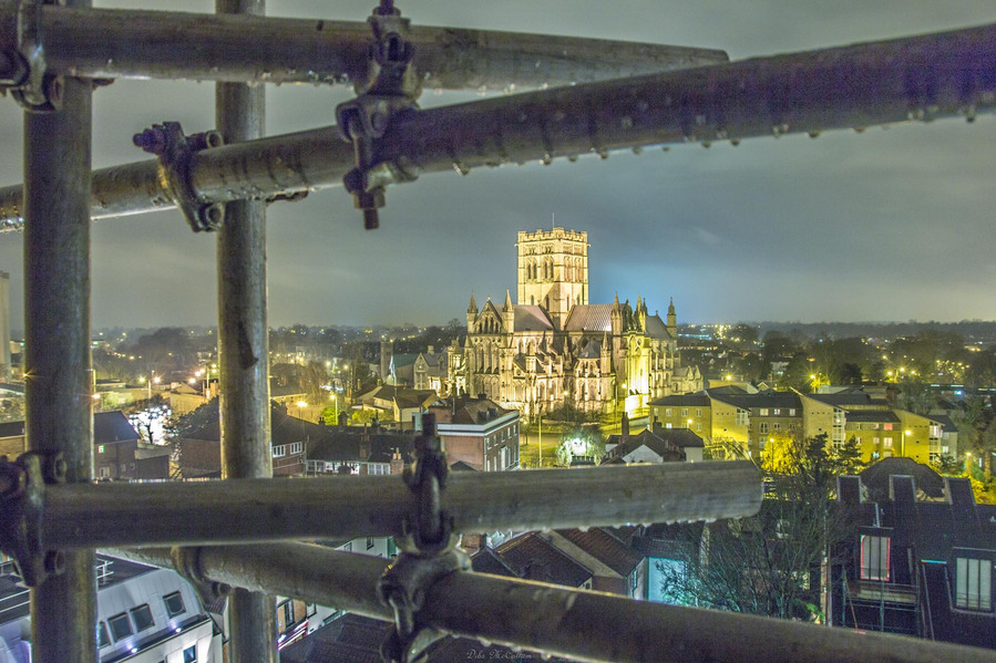 The skyline of Norwich city centre showing St John the baptist roman catholic cathedral at night with the cathedral framed by scaffolding that the image was taken from at night