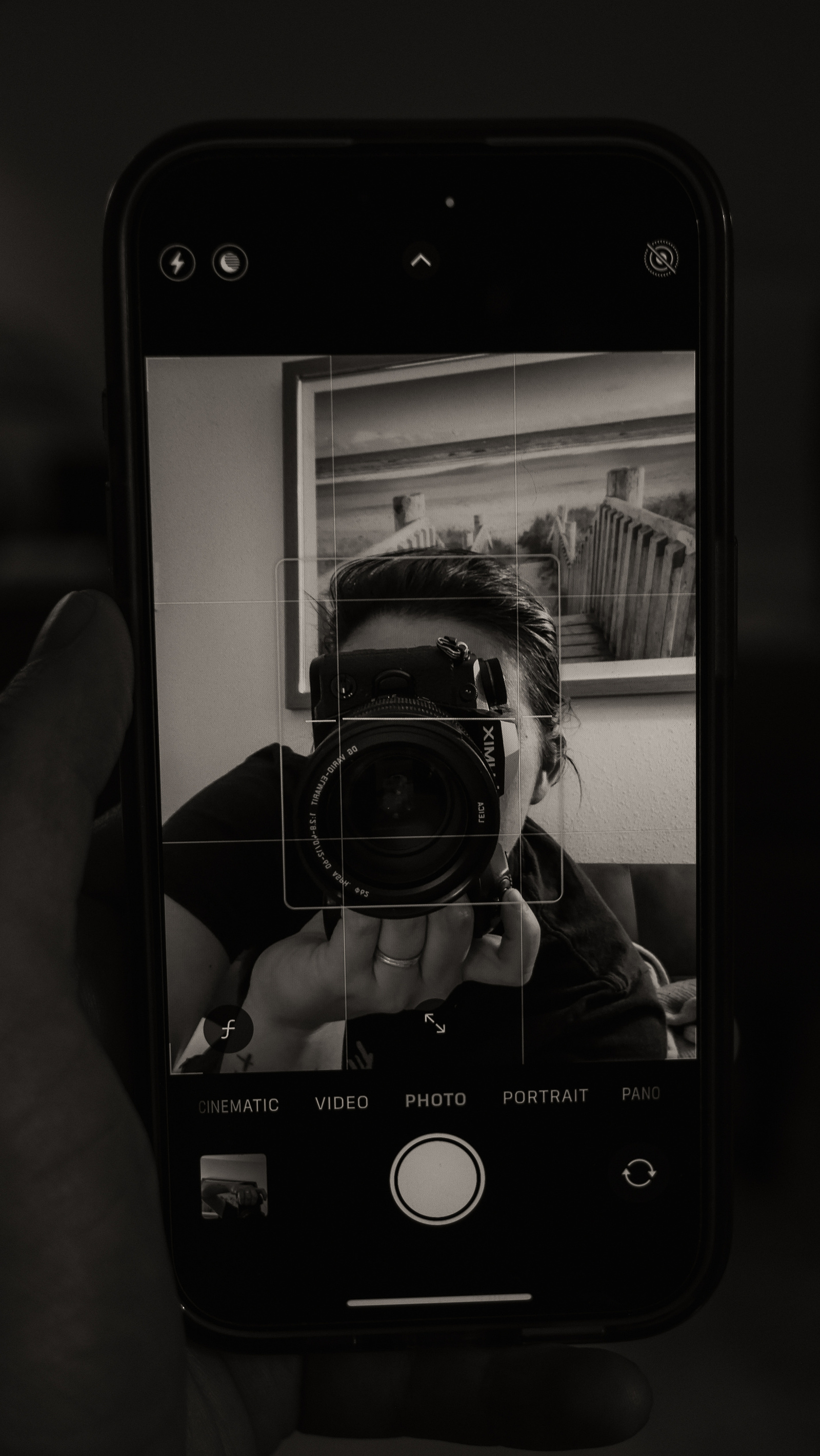 Taking a picture of an iPhone with camera reflecting back.