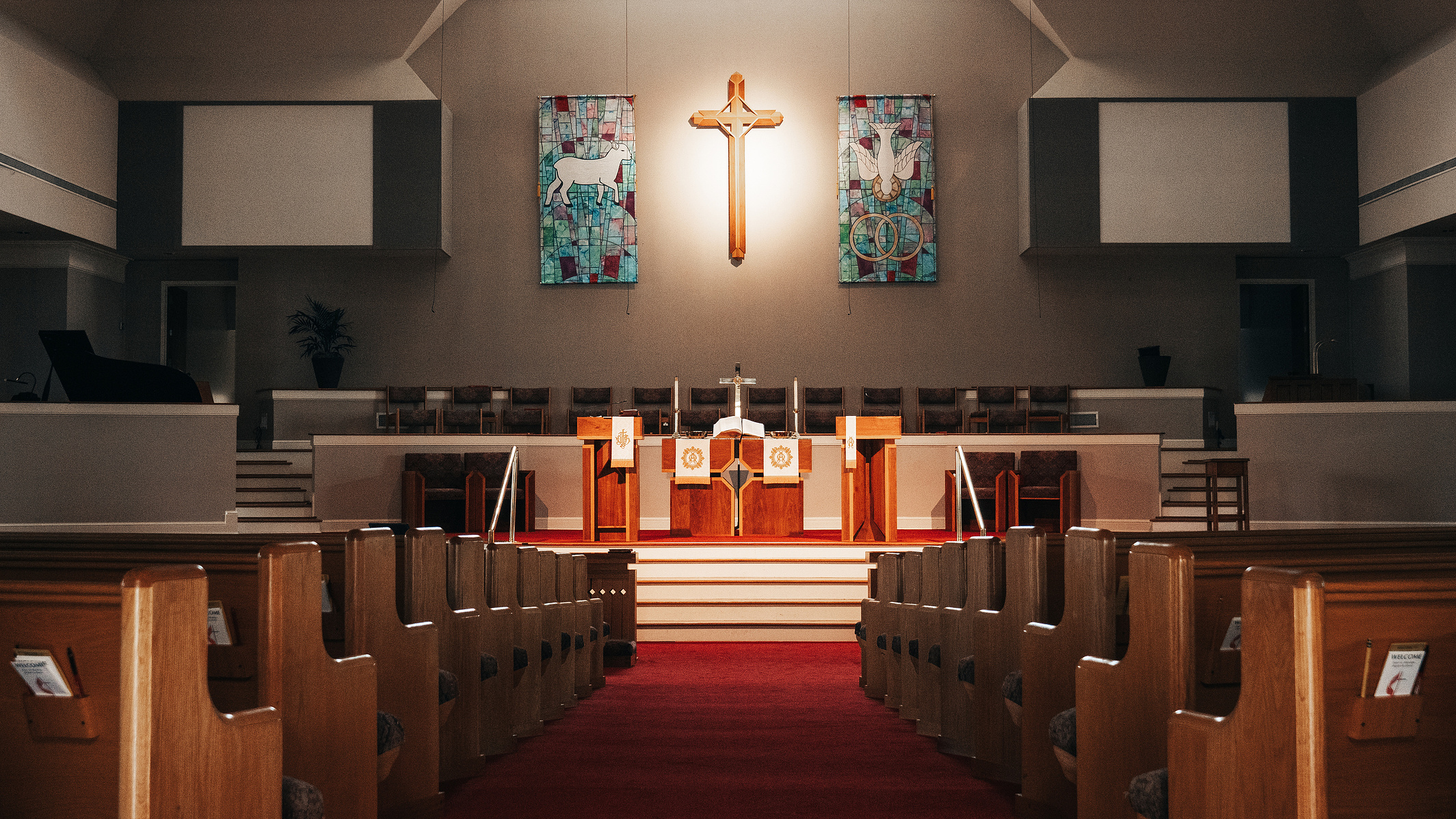 Looking down the isle to the altar of a church.