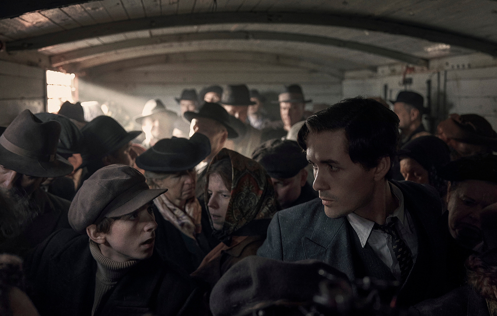 Jonah Hauer-King as Young Lale Sokolov and Ilan Galkoff as Aaron in The Tattooist of Auschwitz (2024), Synchronicity Films, Peacock, SKY Studios