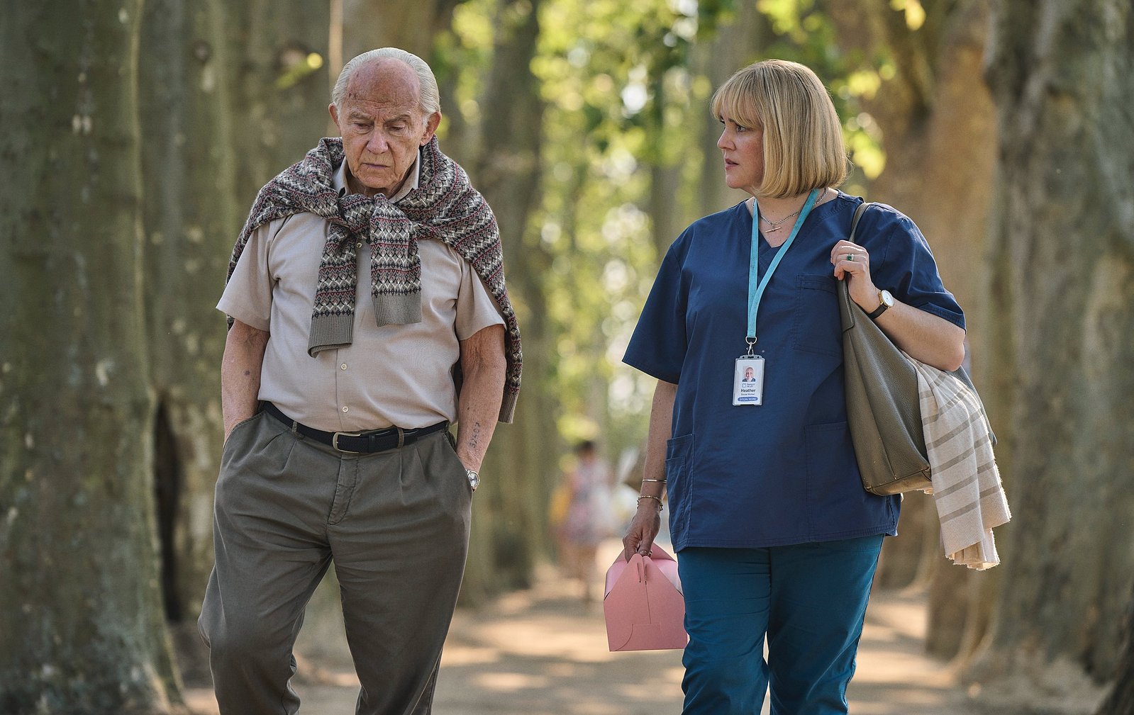 Harvey Keitel as Lale Sokolov and Melanie Lynskey as Heather Morris in The Tattooist of Auschwitz (2024), Synchronicity Films, Peacock, SKY Studios