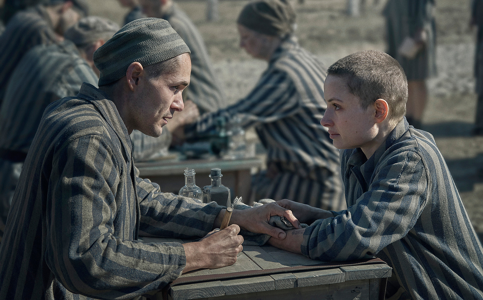Jonah Hauer-King as Young Lale Sokolov and Anna Próchniak as Gita Furman in The Tattooist of Auschwitz (2024), Synchronicity Films, Peacock, SKY Studios