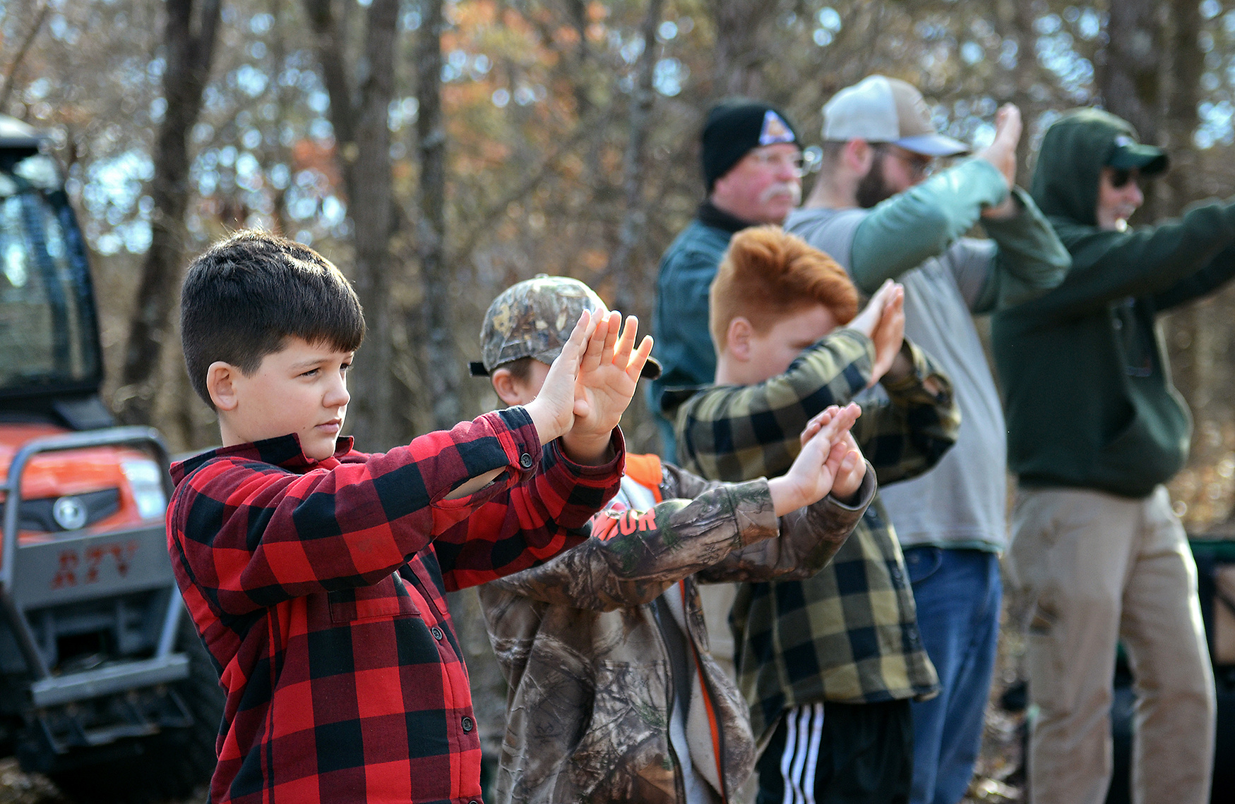 Max Harris, 11, figures out his dominant eye along with other participants on Tuesday, Jan. 30, 2024, at Runge Conservation Nature Center in Jefferson City, Mo. Instructor Austin Lambert taught students basic bow skills, including bow safety.