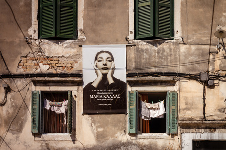 Maria Callas poster on a rustic building in Corfu.