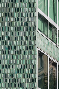 The alternating smooth and diamond-shaped green tiles detail on the facade of the Montedoria Building in Milan, designed by Gio Ponti.