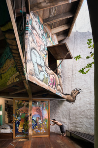 Colourfully hand-painted treehouse in bedroom of a house and studio designed by a21studio.
