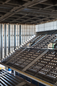 Natural ventilated concrete grandstand sitting inside the Indoor Stadium of the National Sports Complex designed by Vann Molyvann.
