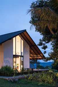 Evening view of Sukasantai Farmstay in Indonesia designed by Goy Architects.